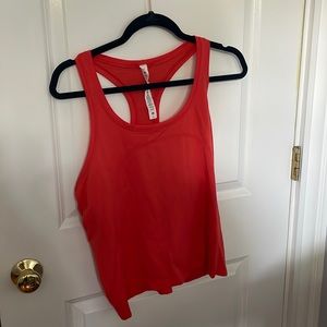 Orangey red swiftly race length tank top